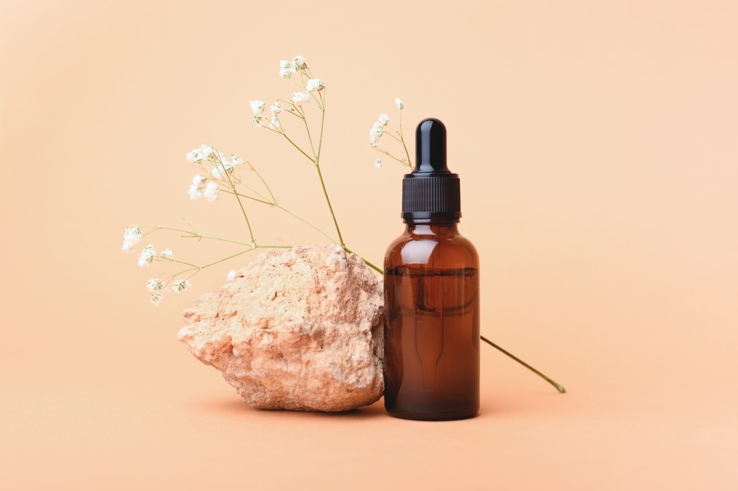 A,Glass,Bottle,With,Aromatic,Oil,Or,Serum,On,A